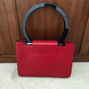 Salvatore Ferragamo Red Leather purse with round black handles. Rare find.